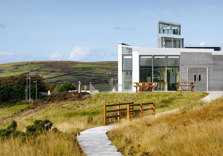 Contemporary building with scenic hills in Ballycroy, Ireland, venue for Mayo Dark Sky Festival events.