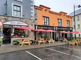 Picturesque street view with colourful shops in Mayo, perfect for visitors attending the Mayo Dark Sky Festival.