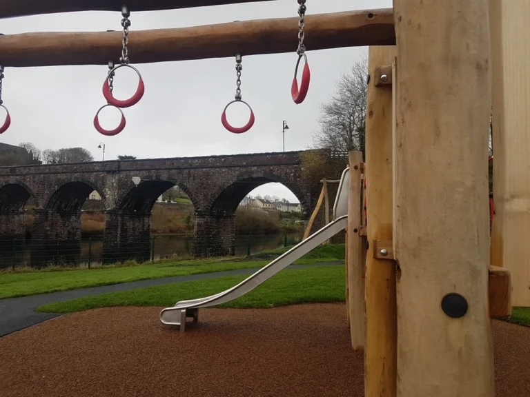 Scenic playground view in Mayo with bridge backdrop, perfect for family fun at the Mayo Dark Sky Festival.